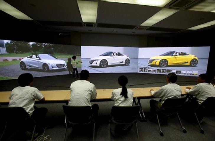 A presentation at the Honda Design Center. Prior to using Unity, designers created simple real-time visualizations of stationary vehicles, like those shown here. (Image credit: <a href="https://global.honda/innovation/design/designstudio/studio3.html#modal1" target="_blank" rel="noopener noreferrer">Honda</a>)