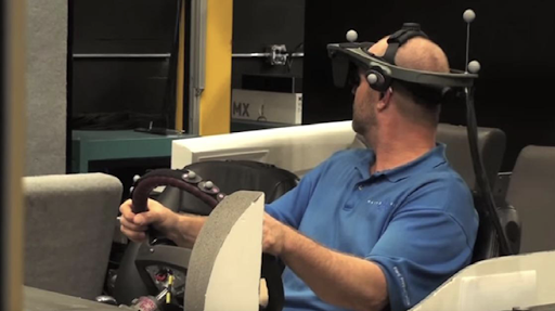 A person driving using a VR headset