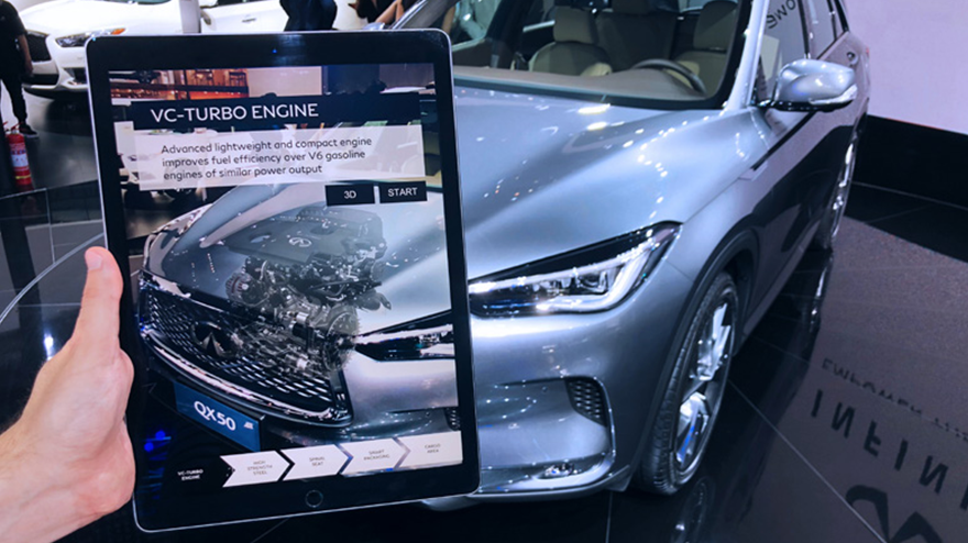 An AR tablet showing engine of a car from outside the vehicle