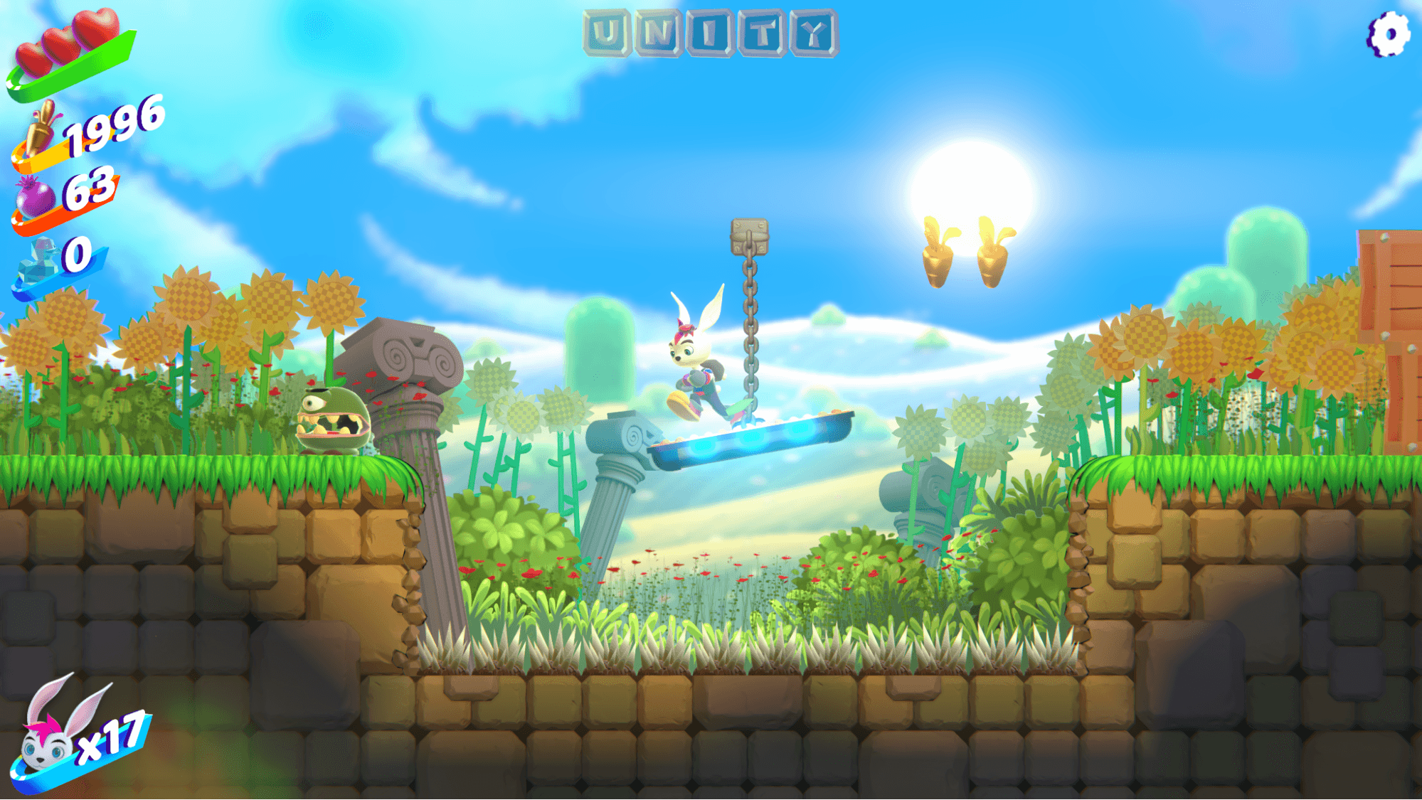 A gameplay screenshot from "Bunny Blitz" showing a rabbit character with pink hair mid-jump on a floating platform in a bright meadow level with sunflowers, ancient stone columns, and golden carrot collectibles. The HUD displays a heart meter, item counts (1996, 63, 0), the word "UNITY" at the top, and "x17" bunny lives at the bottom left.