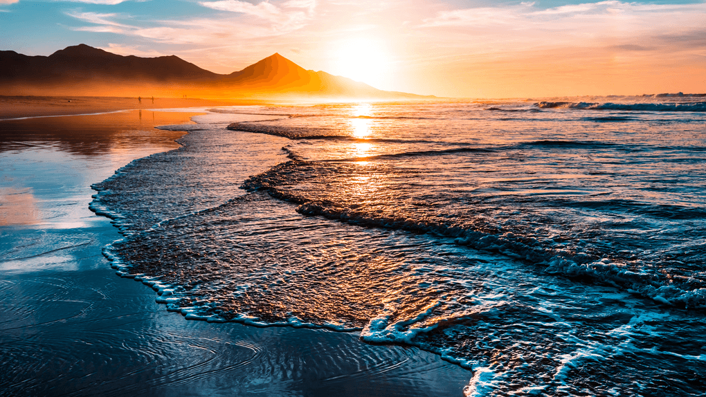 Surf on the beach at sunset