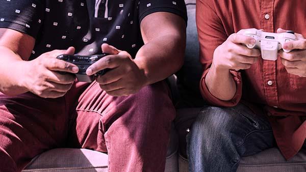 Two people playing a console game