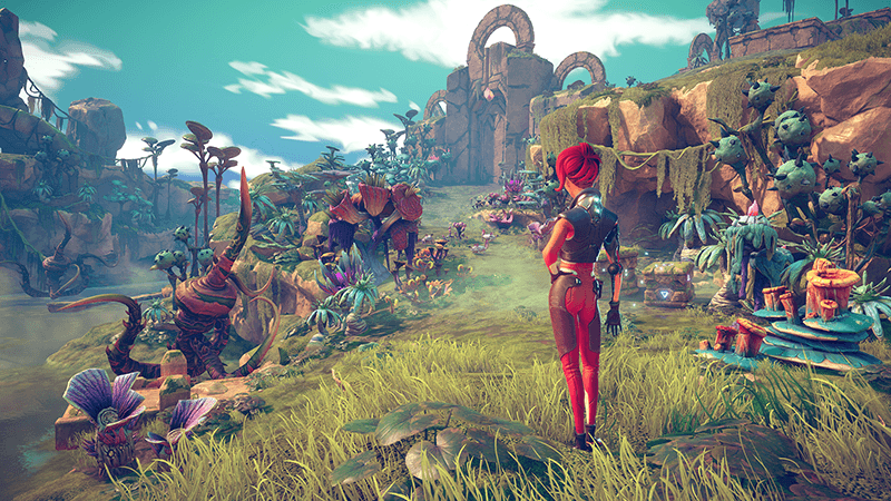 A vibrant, third-person perspective from a video game showing a character with bright red hair and a sleek red and black bodysuit standing in a lush, alien landscape.